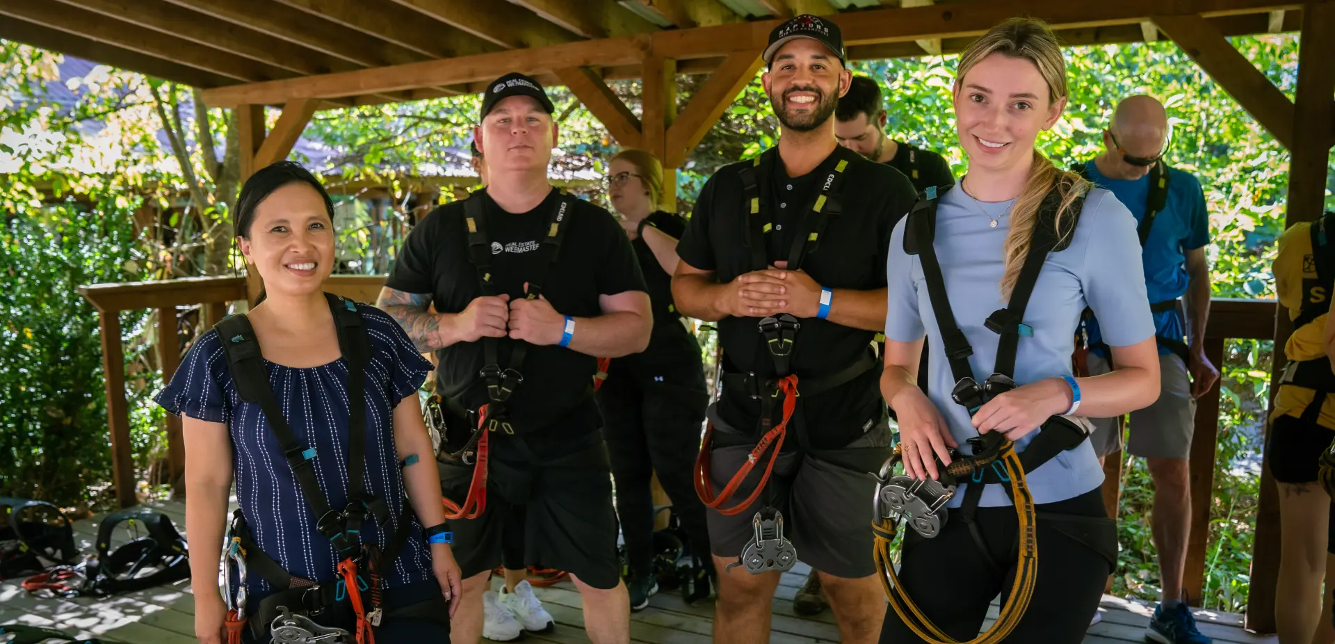 Real Estate Webmasters employees attending a ziplining team day event